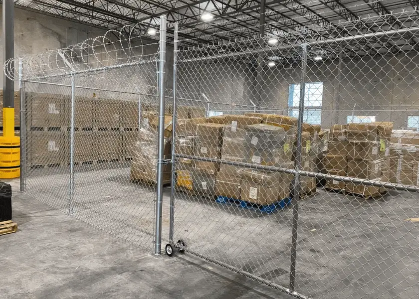 A warehouse with fence inside to protect its items